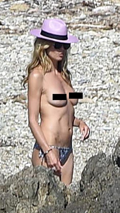 Хайди Клум се пусна по голи гърди на плаж (СНИМКИ 18+)