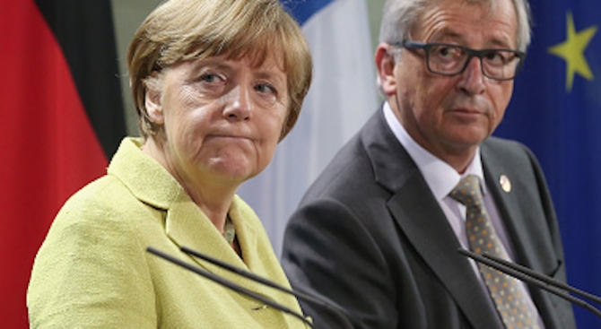 Меркел взе страната на Юнкер в спора с Орбан