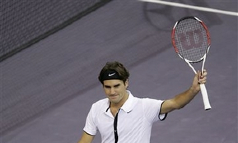 Федерер се радва след победата си над Цонга
