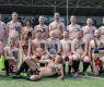 Отбор от чисто голи мери сили с облечени във футболен мач СНИМКИ