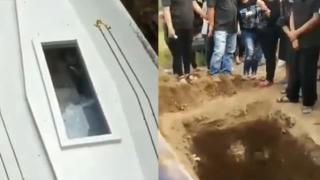 Ужасяващ момент: Мъртвец маха от ковчега, за да го освободят ВИДЕО