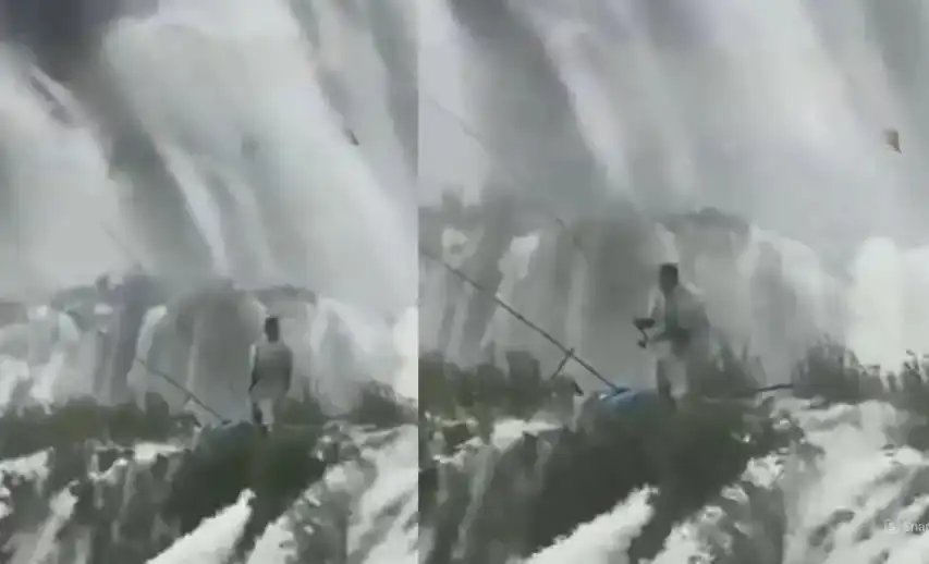 Туристи заснеха мъж, който лови риба във водопад Видео