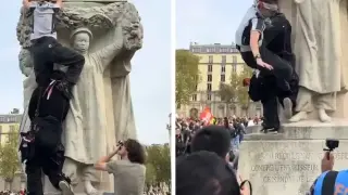 Жена падна от статуя по време на протест Видео 18+