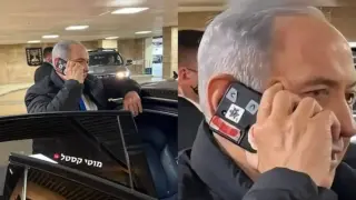 Защо Нетаняху лепи червено тиксо върху телефона си